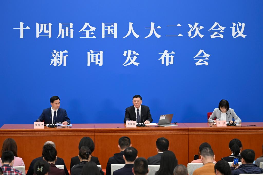 3月4日，十四屆全國人大二次會議在北京人民大會堂舉行新聞發(fā)布會。大會發(fā)言人婁勤儉就大會議程和人大工作相關(guān)問題回答中外記者的提問。 新華社記者 牟宇 攝